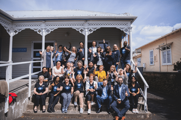 asthma hui crew sitting on steps for group photo